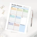 minimalist weekly planner with color-coded daily columns, weekly focus sections, and space for reflection and next-week planning.